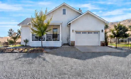 Front of the home with covered porch and garage